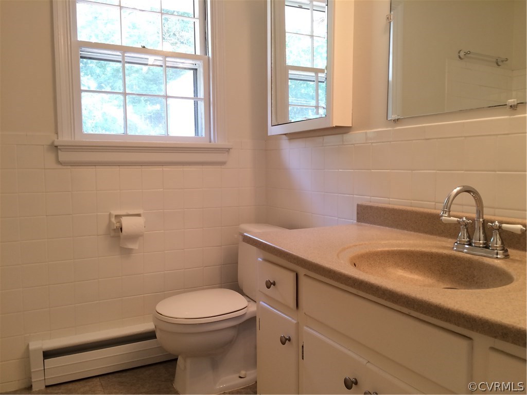 4035 Collingbourne Road Richmond, VA 23235 - Photo 22 of 30 a bathroom with a sink a toilet and a window