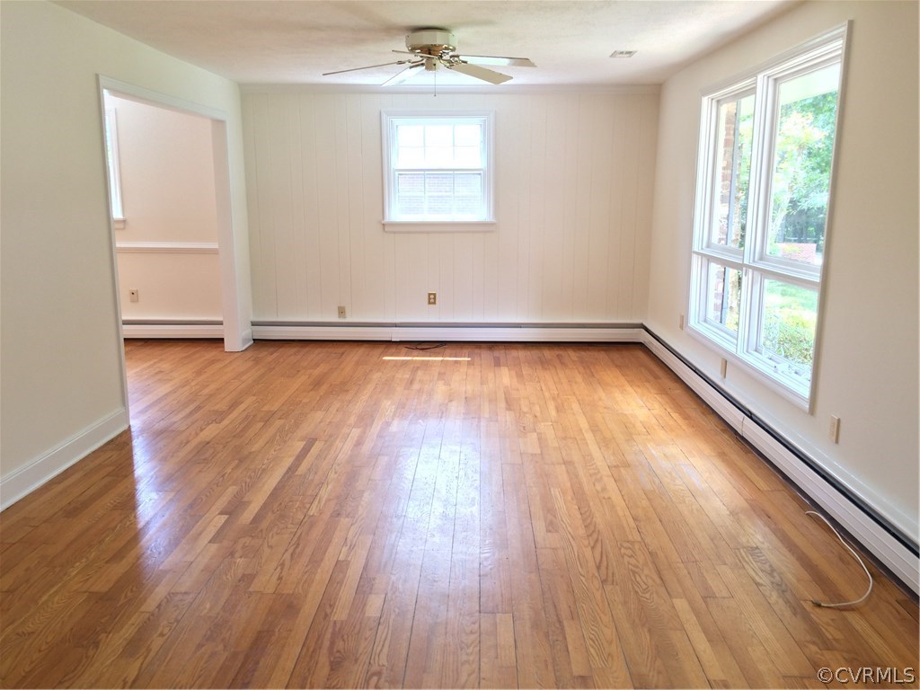 4035 Collingbourne Road Richmond, VA 23235 - Photo 8 of 30 an empty room with wooden floor and windows