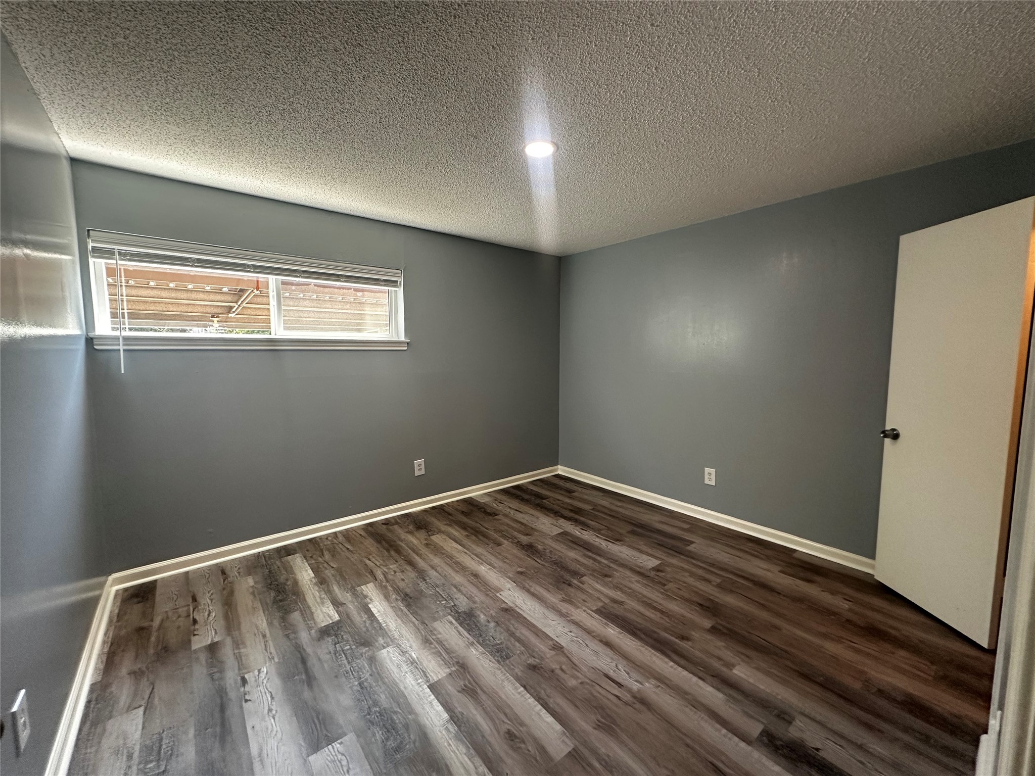 3262 Branard Street, Unit 17 Houston, TX 77098 - Photo 3 of 8 a view of room with window and hardwood floor
