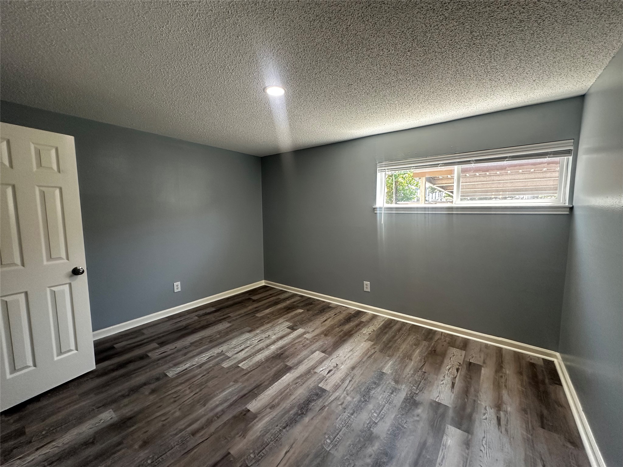 3262 Branard Street, Unit 17 Houston, TX 77098 - Photo 4 of 8 a view of empty room with wooden floor