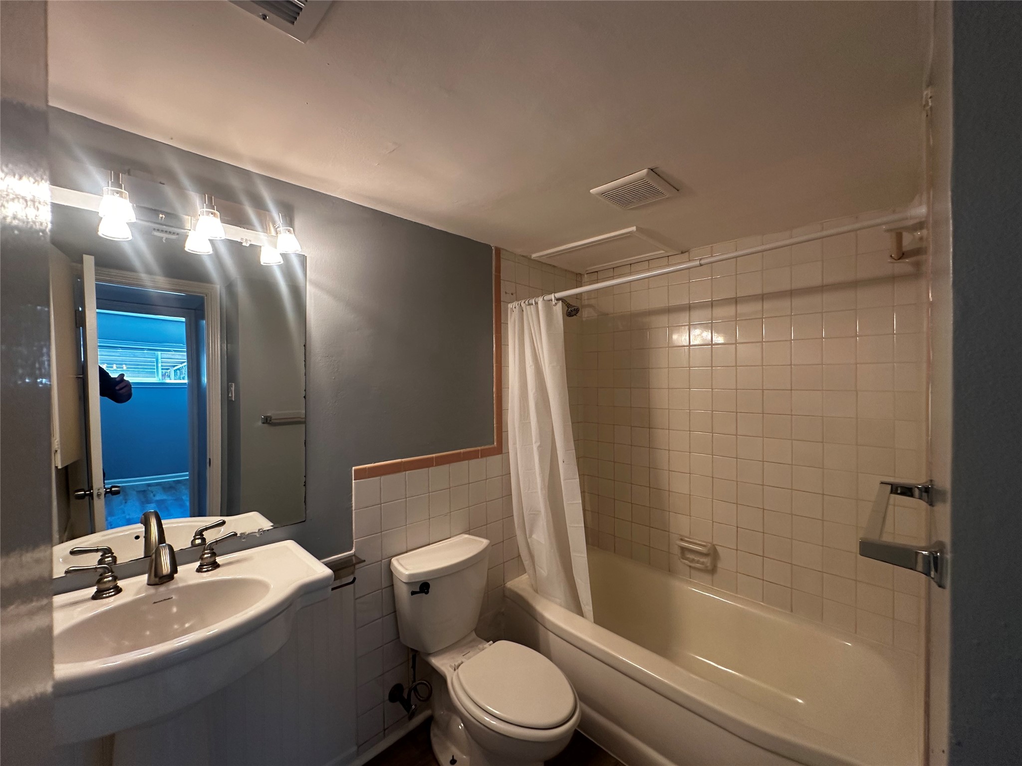 3262 Branard Street, Unit 17 Houston, TX 77098 - Photo 8 of 8 a bathroom with a sink toilet and shower