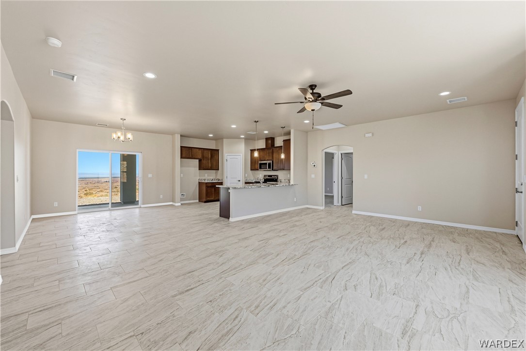 9818 North Cyrus Road Kingman, AZ 86401 - Photo 11 of 42 a view of a kitchen with a sink and a stove top oven