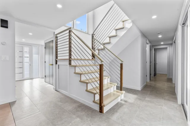 a kitchen with stainless steel appliances a stove and a microwave