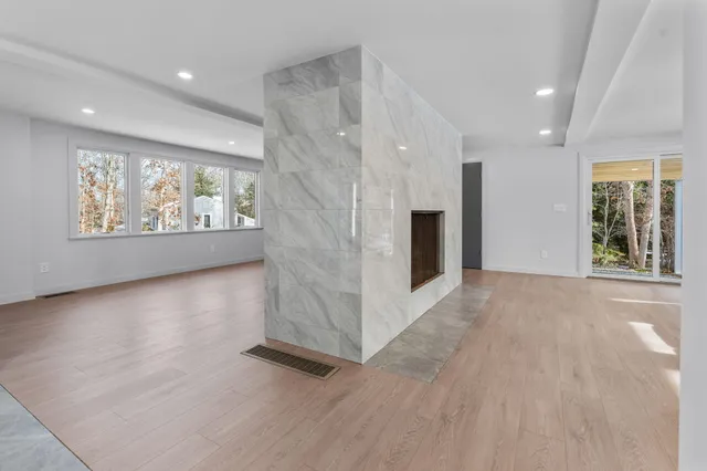 a bathroom with a shower toilet and sink