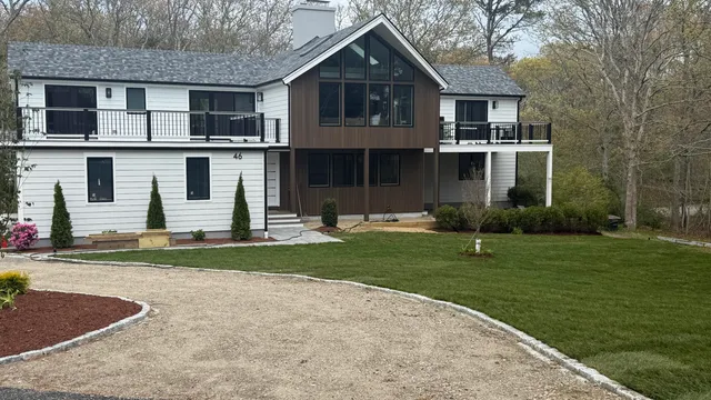 a front view of a house with a yard