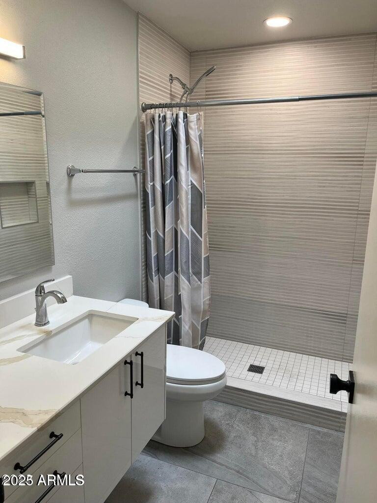 7440 East Cave Creek Road, Unit 1 Carefree, AZ 85377 - Photo 11 of 47 a bathroom with a sink a toilet and shower