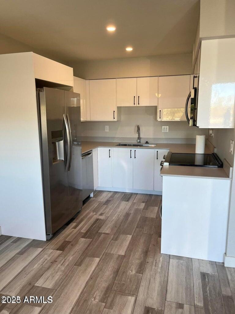7440 East Cave Creek Road, Unit 1 Carefree, AZ 85377 - Photo 2 of 47 a kitchen with stainless steel appliances granite countertop a refrigerator a sink and a stove