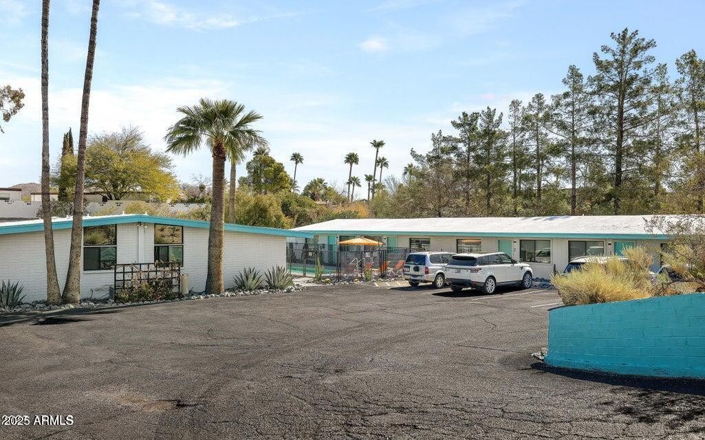 7440 East Cave Creek Road, Unit 1 Carefree, AZ 85377 - Photo 34 of 47 a view of a cars park in front of house