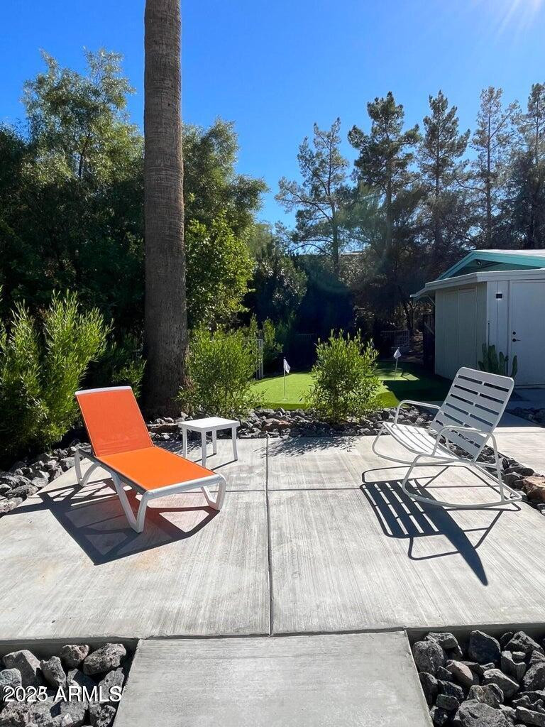7440 East Cave Creek Road, Unit 1 Carefree, AZ 85377 - Photo 4 of 47 a view of a patio with chairs and plants