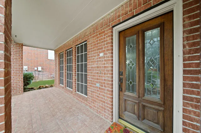 a large kitchen with a stove top oven a sink a microwave and cabinets