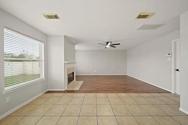 a spacious bathroom with a granite countertop tub sink and mirror