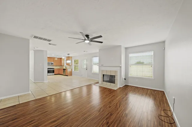 a spacious bathroom with a granite countertop tub sink and mirror