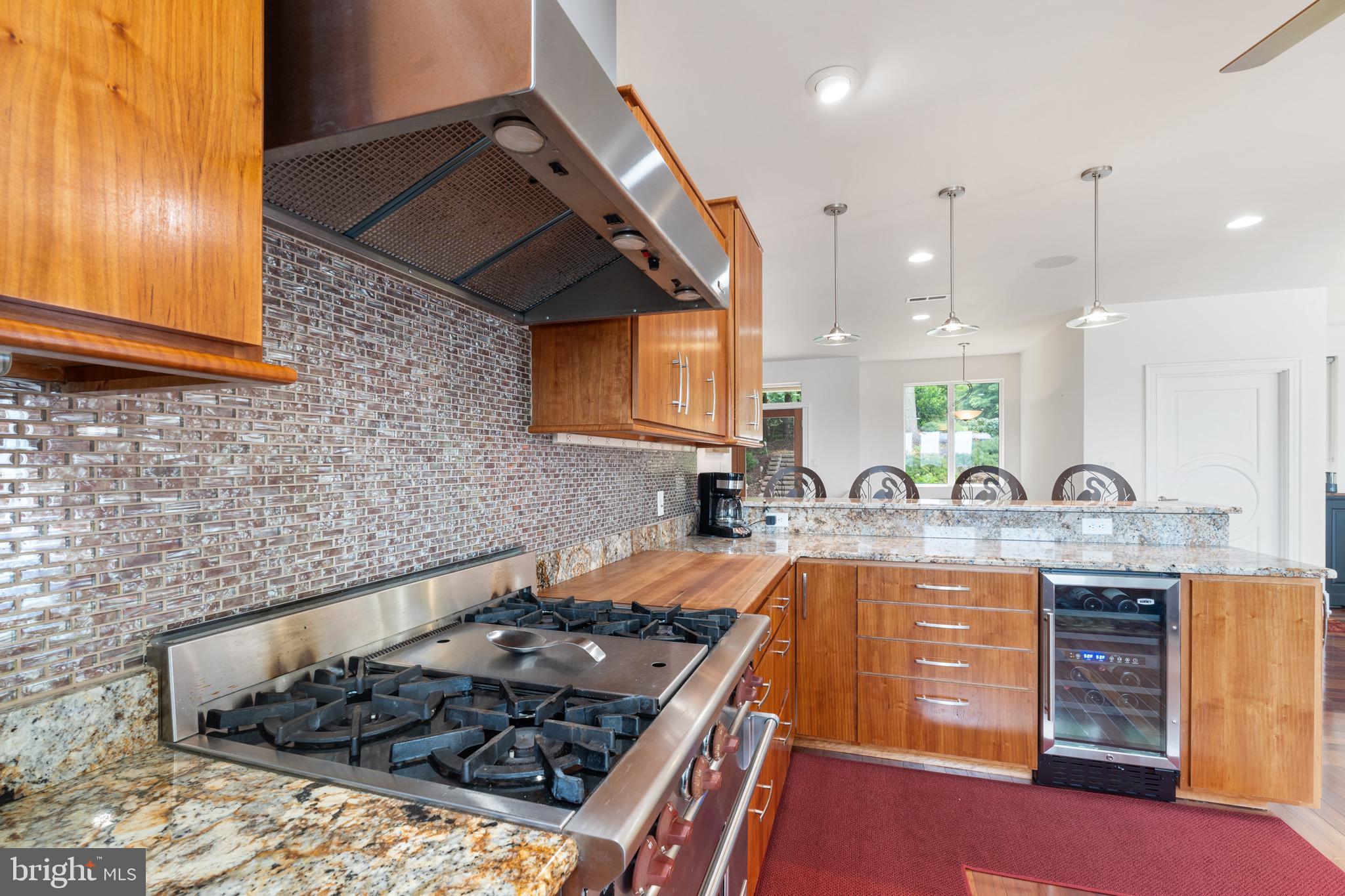 174 Virginia Key Trail Union Hall, VA 24176 - Photo 20 of 85 a kitchen with stainless steel appliances granite countertop a stove a sink and a microwave