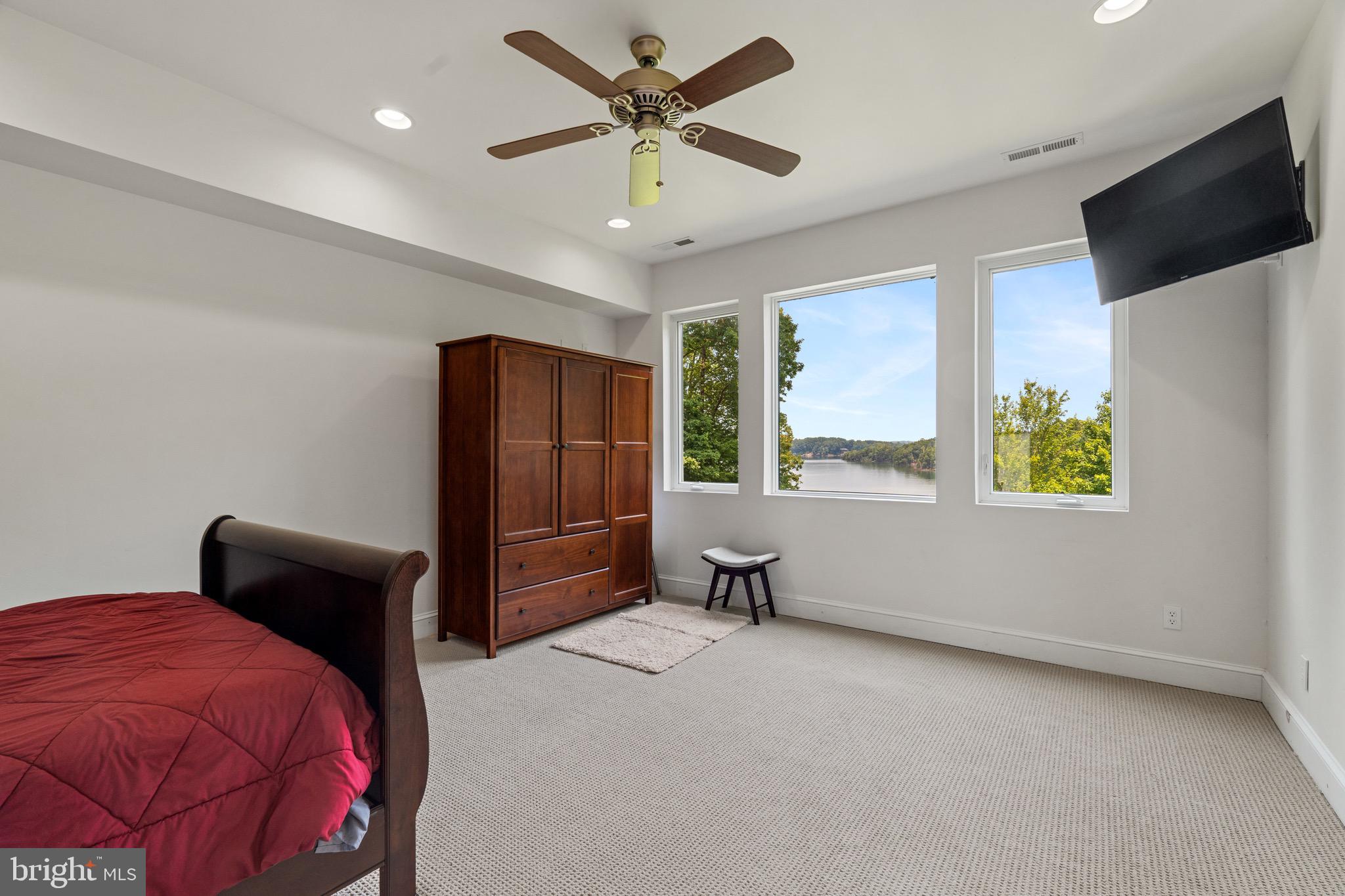174 Virginia Key Trail Union Hall, VA 24176 - Photo 24 of 85 a bedroom with a bed and a window