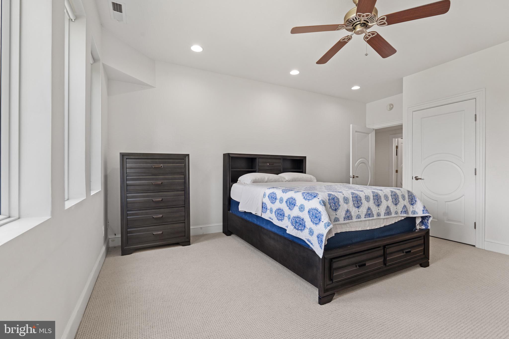 174 Virginia Key Trail Union Hall, VA 24176 - Photo 30 of 85 a bedroom with a bed and ceiling fan