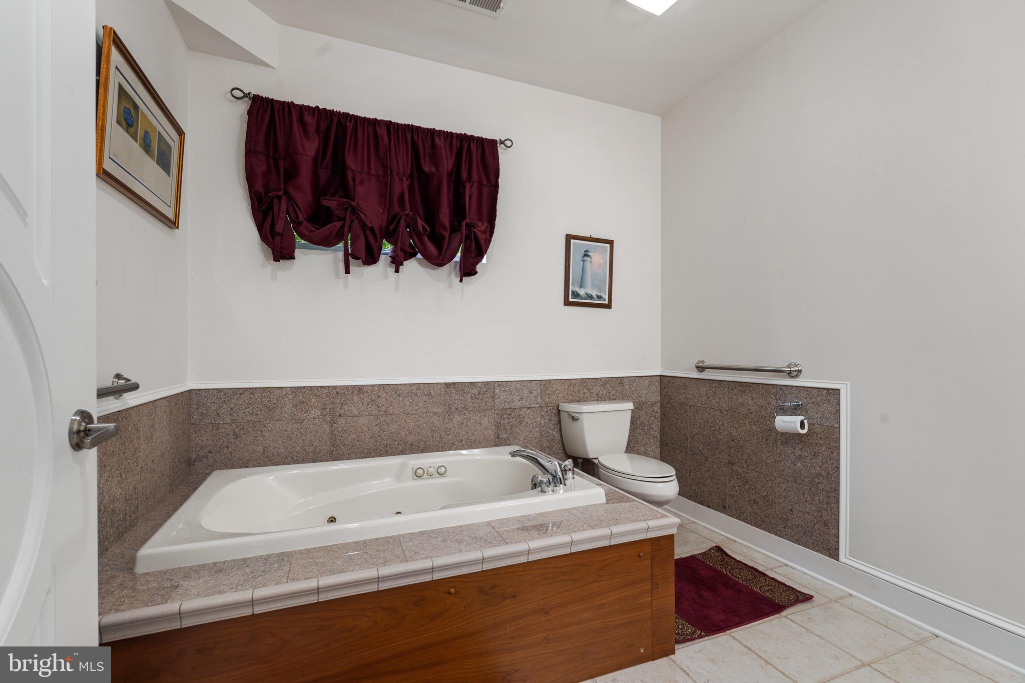 174 Virginia Key Trail Union Hall, VA 24176 - Photo 44 of 85 a bathroom with a tub sink and cabinet