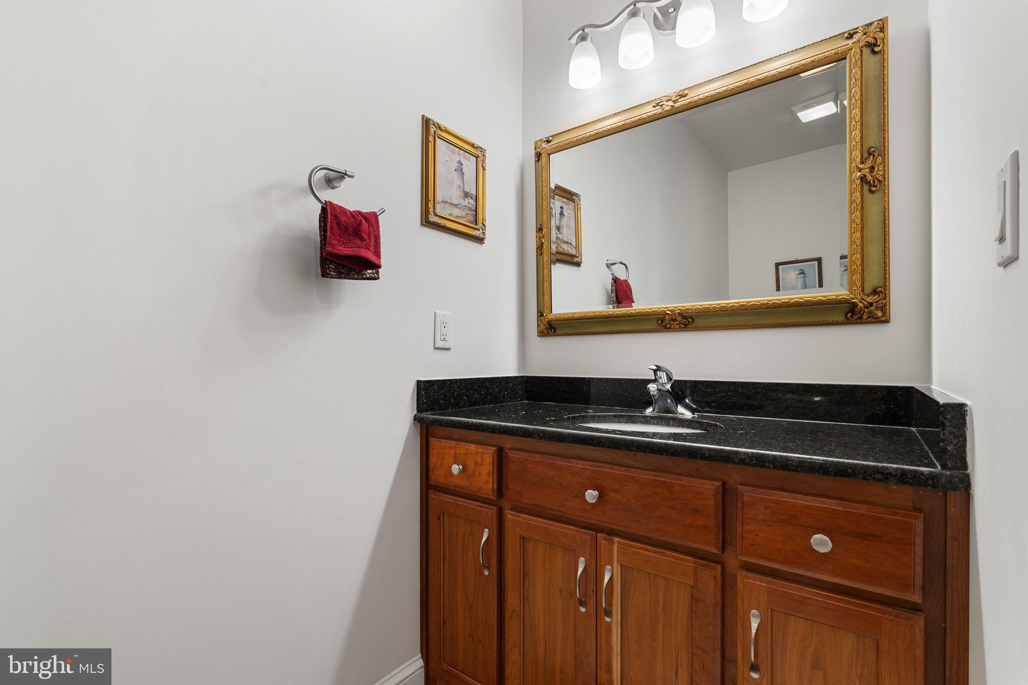 174 Virginia Key Trail Union Hall, VA 24176 - Photo 46 of 85 a bathroom with a granite countertop sink and a mirror