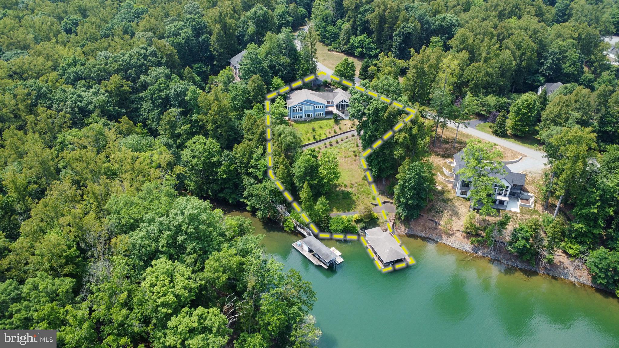 174 Virginia Key Trail Union Hall, VA 24176 - Photo 66 of 85 an aerial view of a house with a yard and lake view