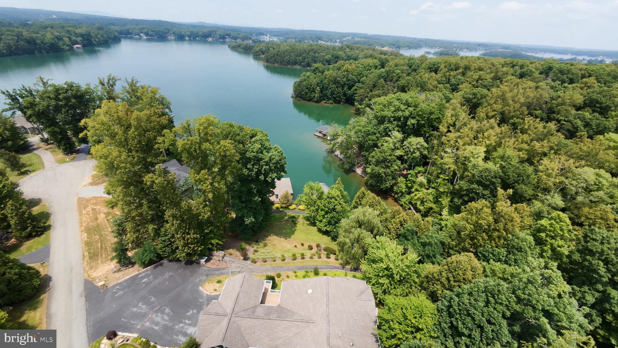 174 Virginia Key Trail Union Hall, VA 24176 - Photo 69 of 85 an aerial view of a house with a yard and lake view