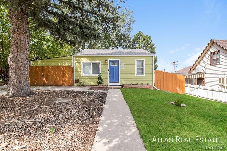 661 Stuart Street Denver, CO 80204 - Photo 1 of 18 a view of a house with yard and a garden