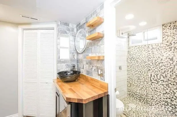 a bathroom with a sink and a shower