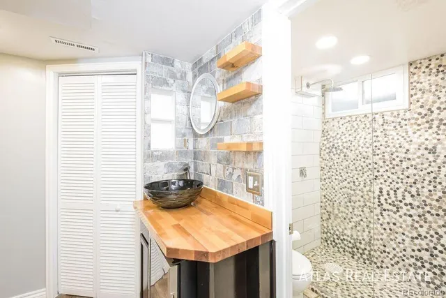 a bathroom with a sink and a shower