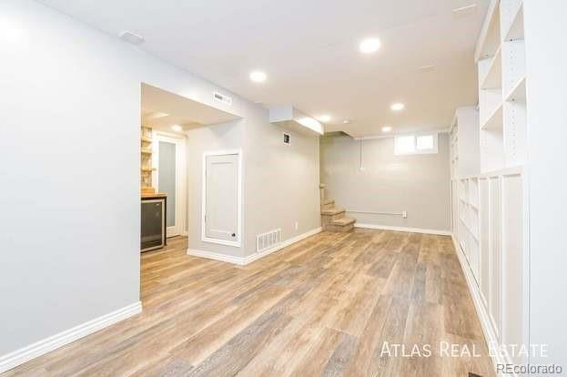 661 Stuart Street Denver, CO 80204 - Photo 10 of 18 a view of a hallway with wooden floor