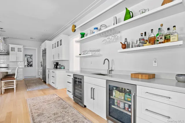 a kitchen with stainless steel appliances granite countertop a sink and cabinets