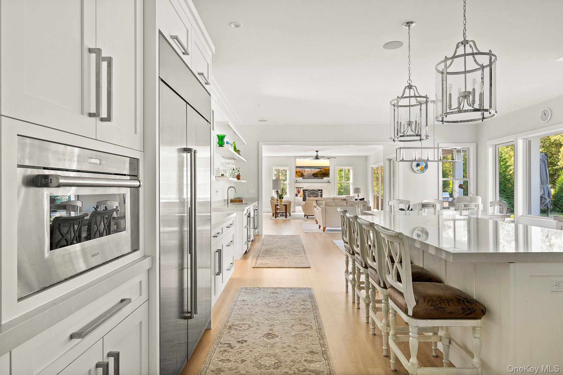 41 Arbutus Road Quogue, NY 11959 - Photo 13 of 35 a view of a hallway with wooden floor and staircase