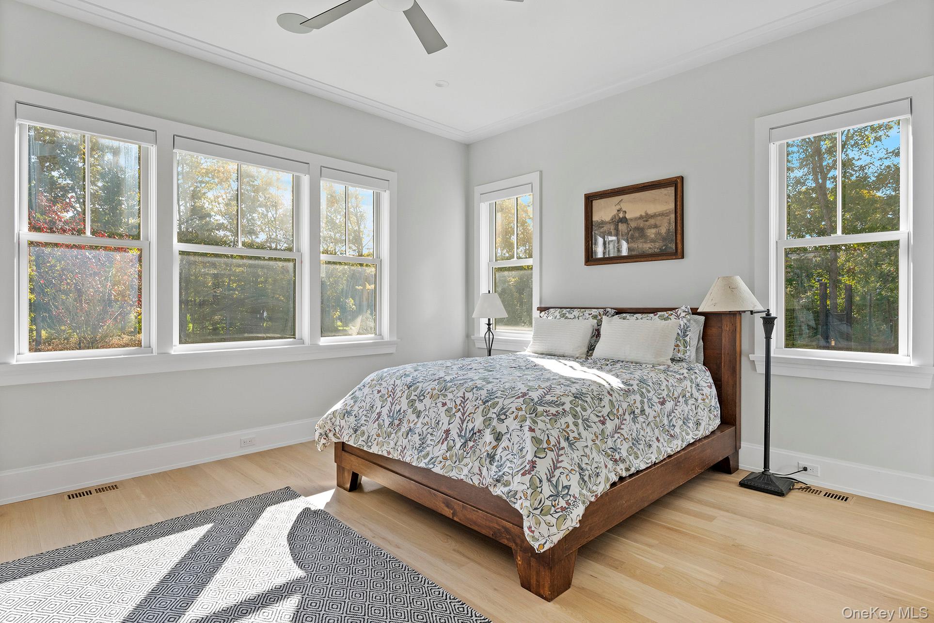 41 Arbutus Road Quogue, NY 11959 - Photo 15 of 35 a bedroom with a bed lamp and window
