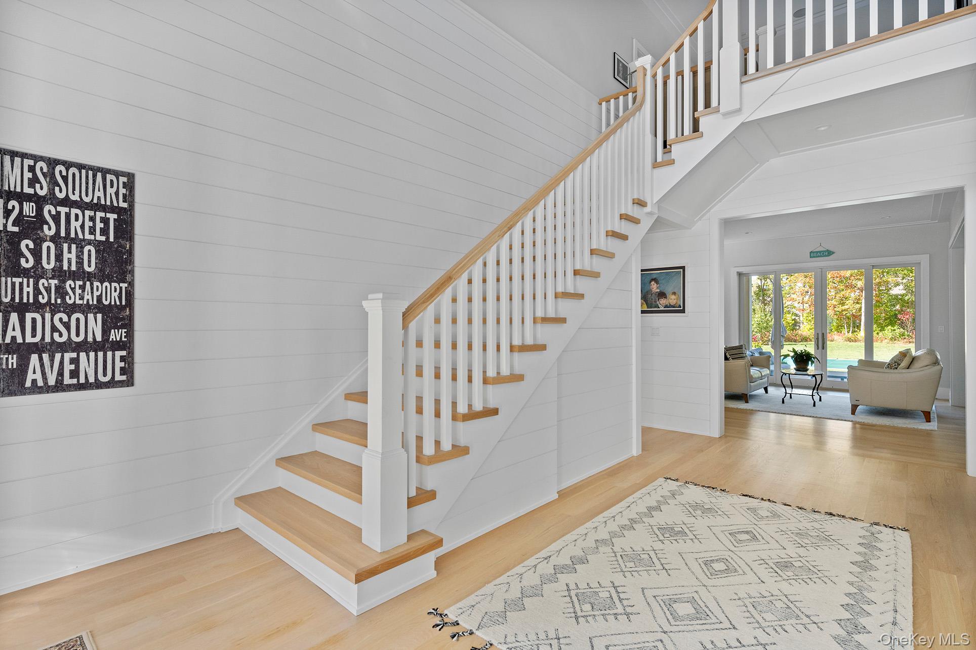 41 Arbutus Road Quogue, NY 11959 - Photo 18 of 35 a view of staircase with white walls and windows