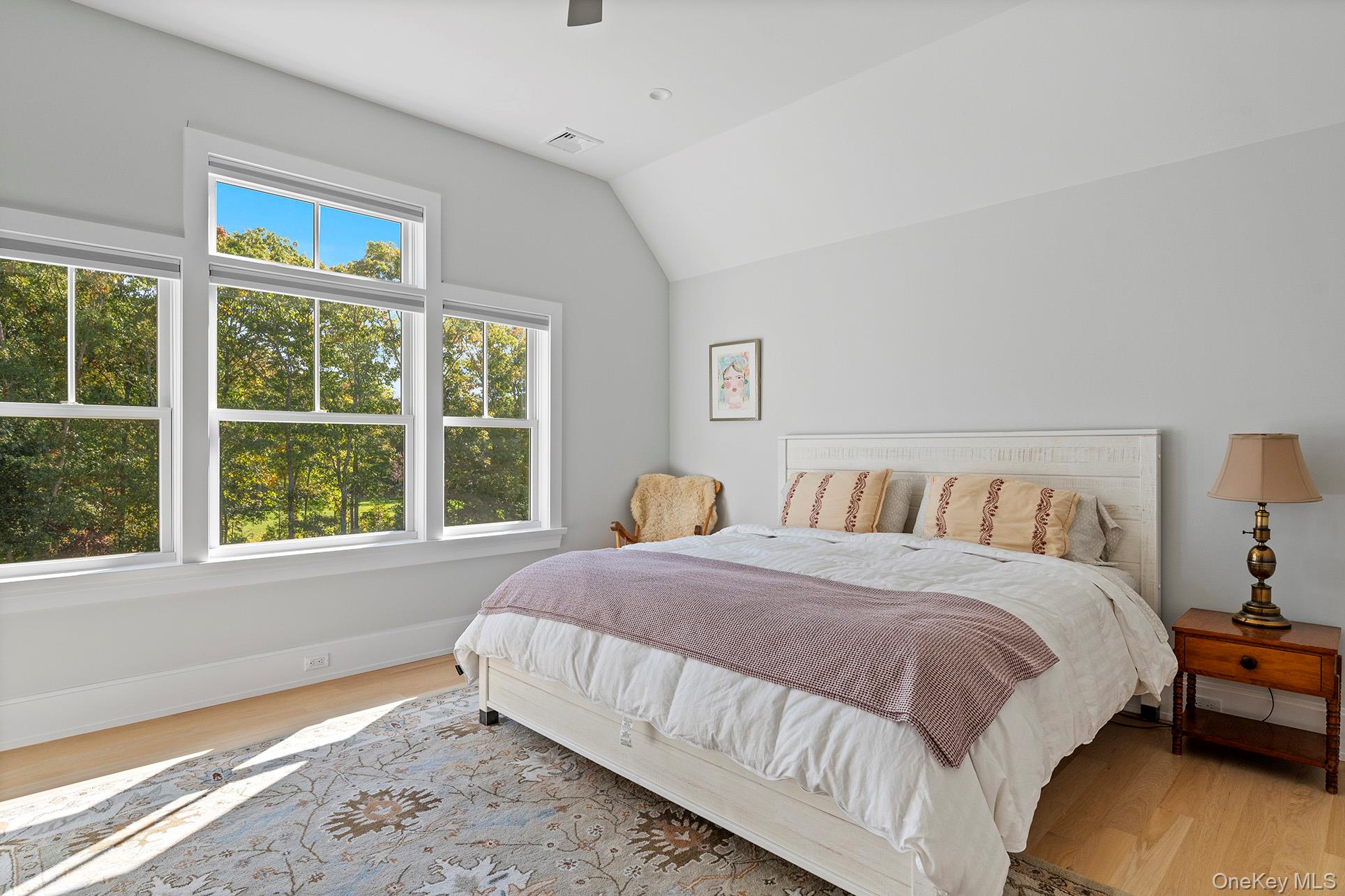 41 Arbutus Road Quogue, NY 11959 - Photo 26 of 35 a bedroom with a bed and a large window