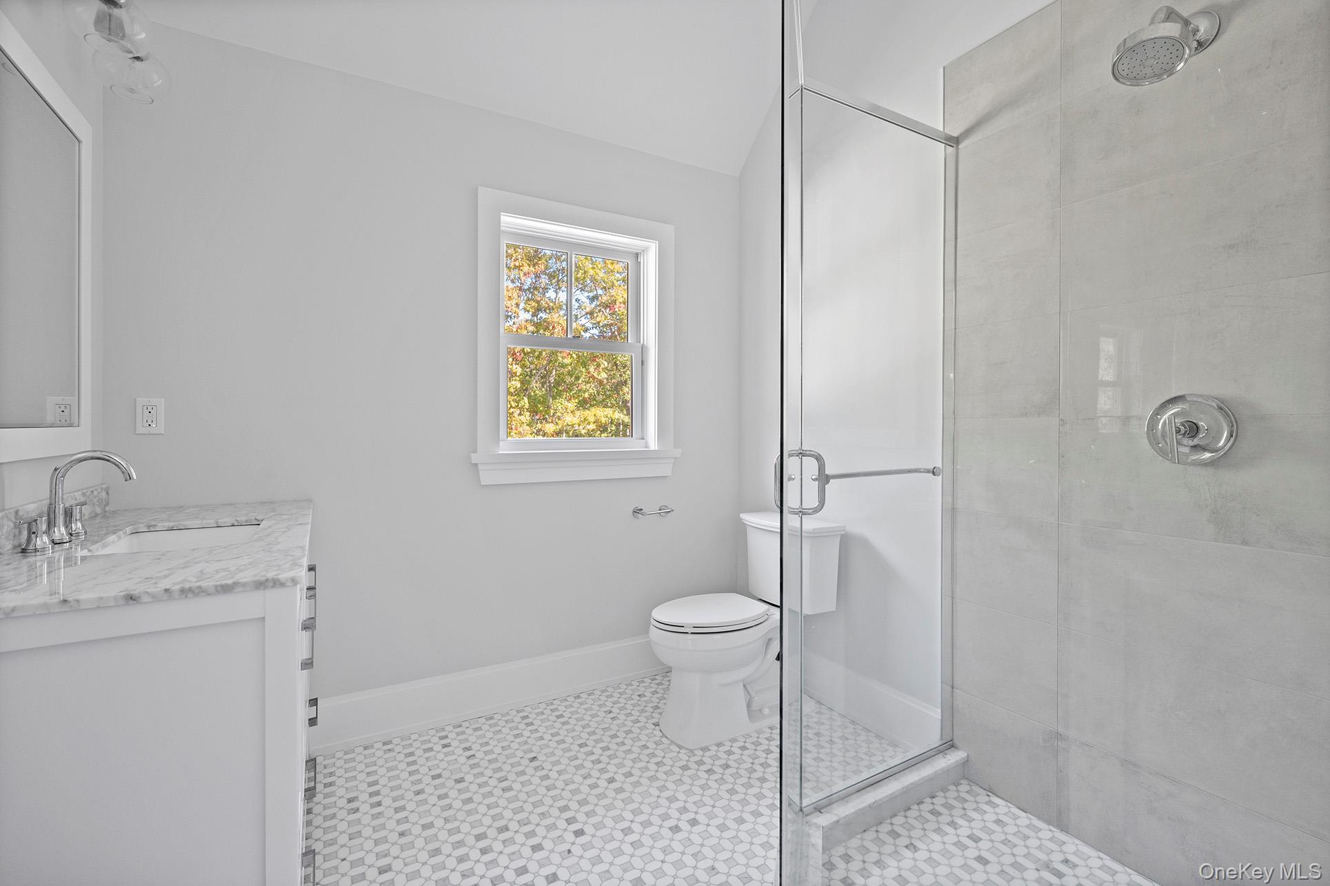 41 Arbutus Road Quogue, NY 11959 - Photo 28 of 35 a bathroom with a sink a toilet and shower