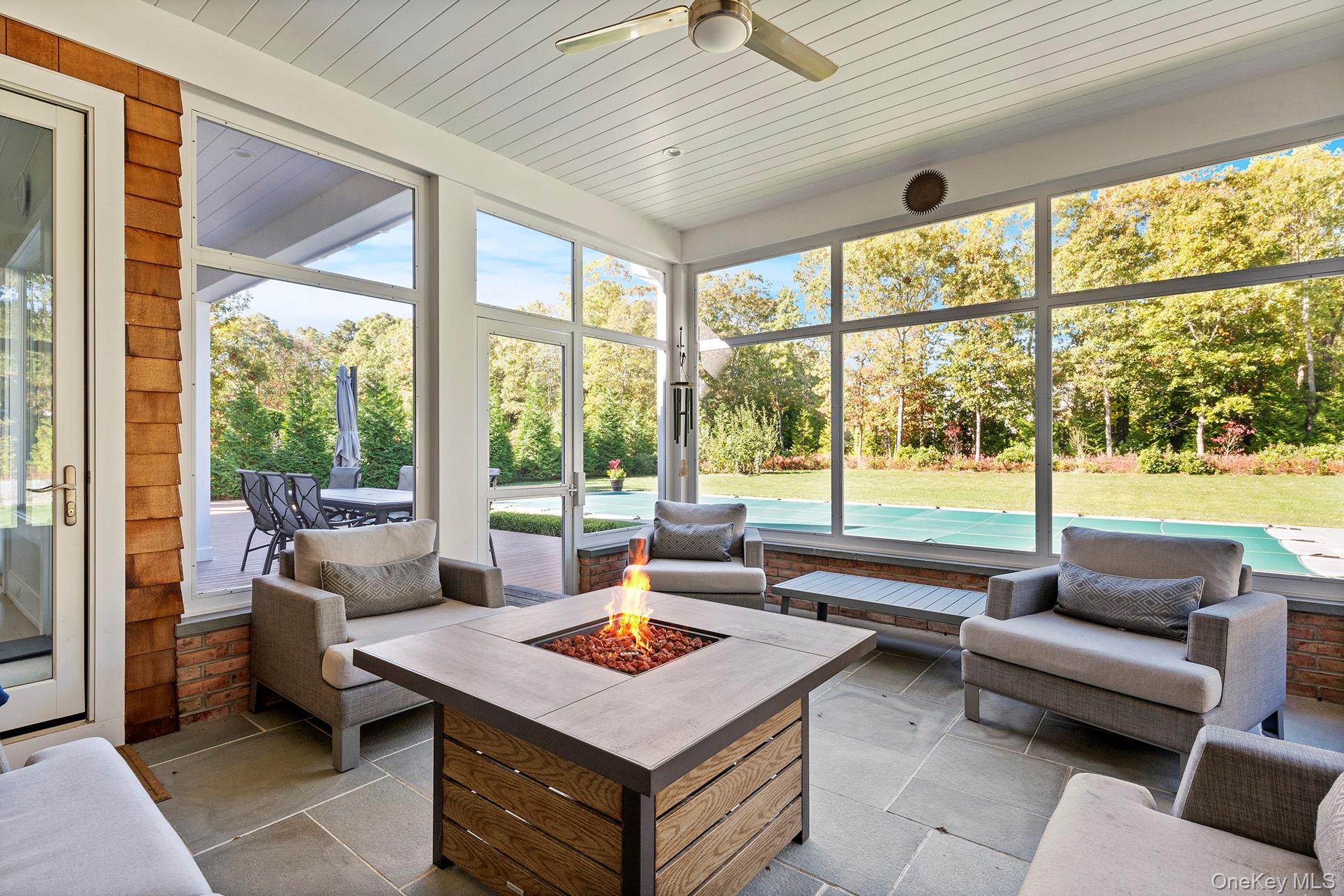 41 Arbutus Road Quogue, NY 11959 - Photo 33 of 35 a living room with furniture and a large window