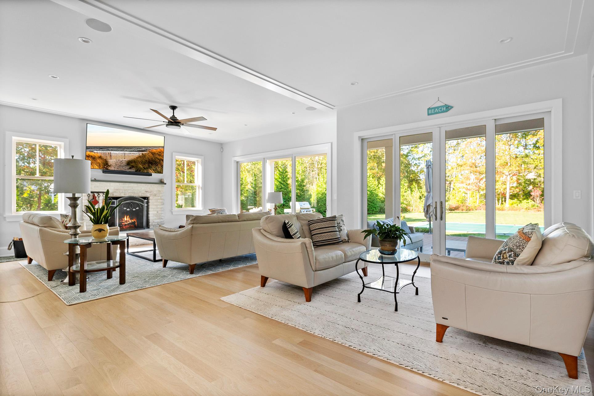 41 Arbutus Road Quogue, NY 11959 - Photo 8 of 35 a living room with furniture and a large window
