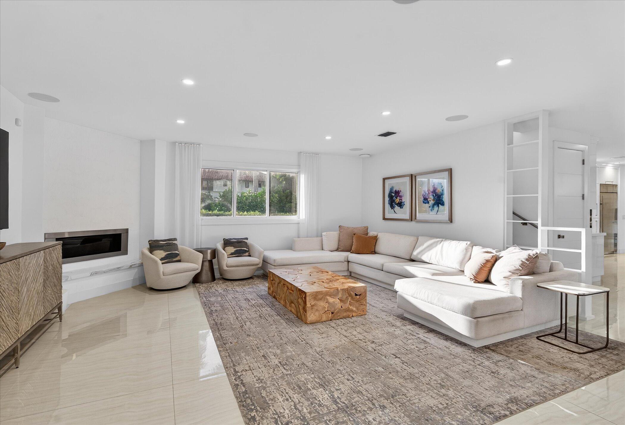 3872 Northwest 53rd Street Boca Raton, FL 33496 - Photo 14 of 43 a living room with furniture and a large window