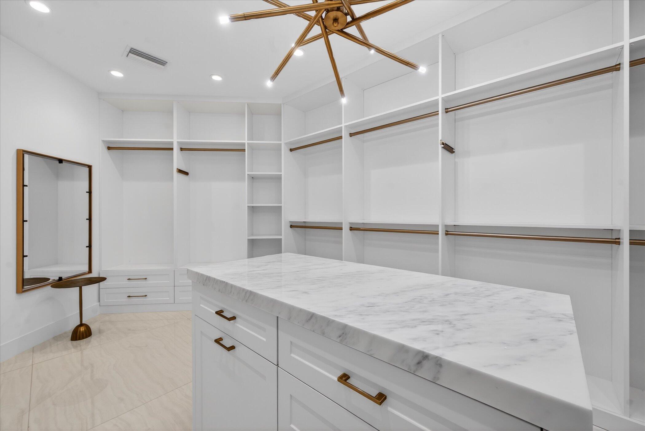 3872 Northwest 53rd Street Boca Raton, FL 33496 - Photo 20 of 43 a hallway with cabinets and wooden floor