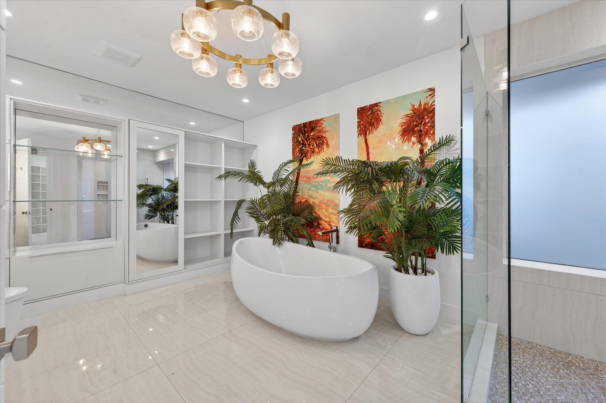 3872 Northwest 53rd Street Boca Raton, FL 33496 - Photo 22 of 43 a view of an empty room with a potted plant and a bath tub