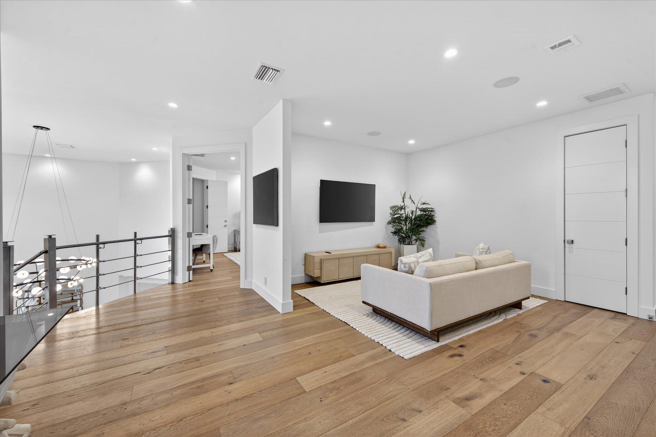 3872 Northwest 53rd Street Boca Raton, FL 33496 - Photo 26 of 43 a living room with furniture wooden floor and a flat screen tv