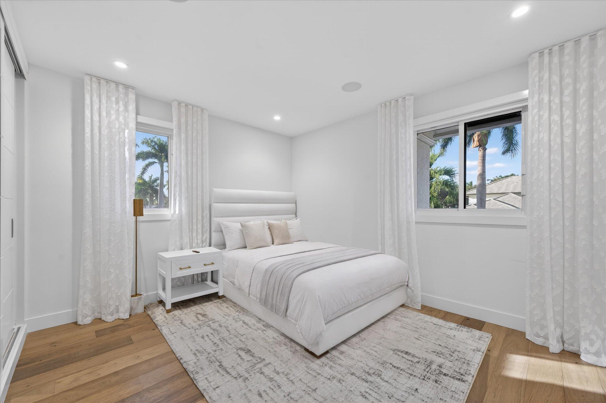 3872 Northwest 53rd Street Boca Raton, FL 33496 - Photo 29 of 43 a bedroom with a large bed and a window