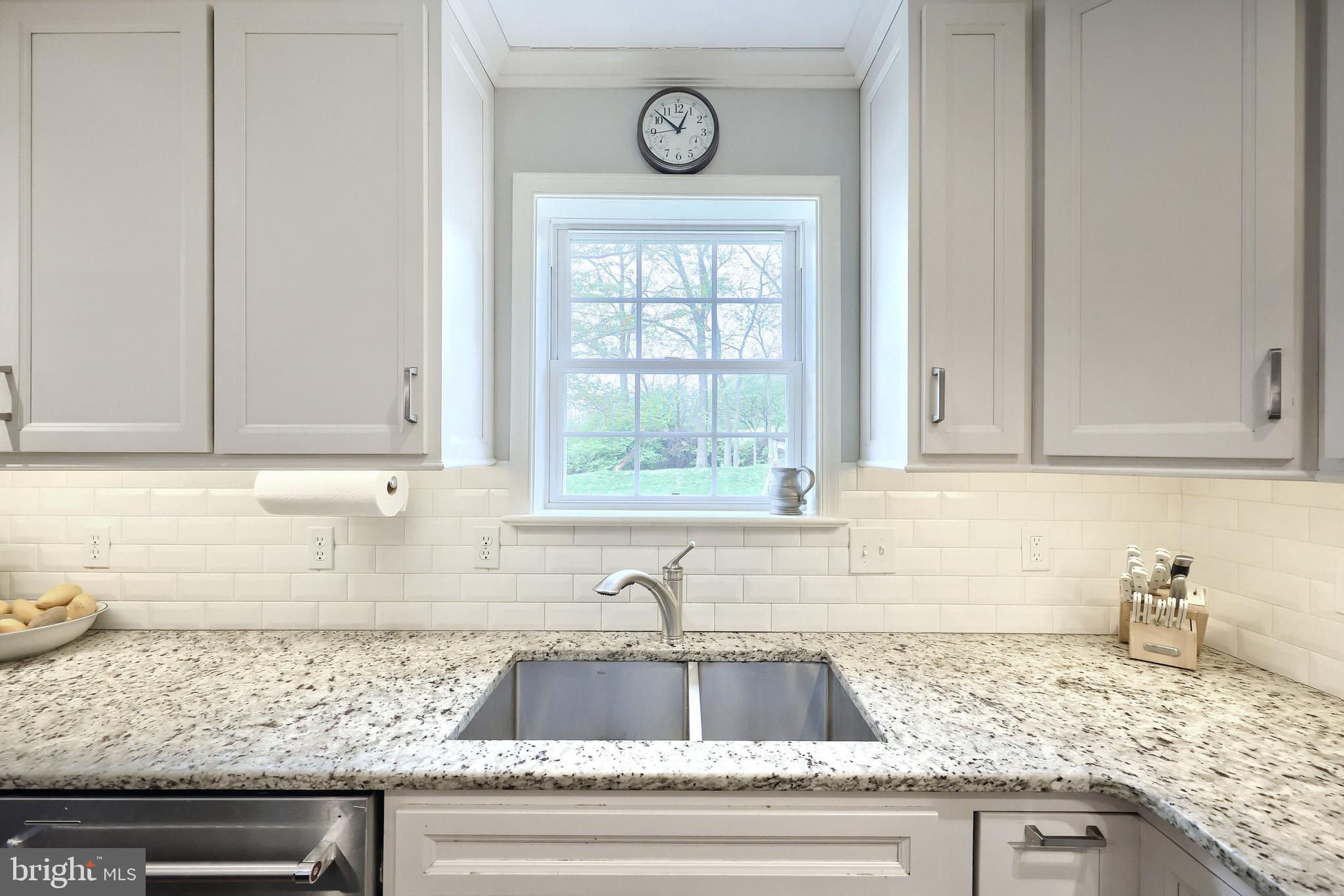 710 Apple Tree Lane Mount Wolf, PA 17347 - Photo 15 of 47 a kitchen with granite countertop a sink a window and cabinets