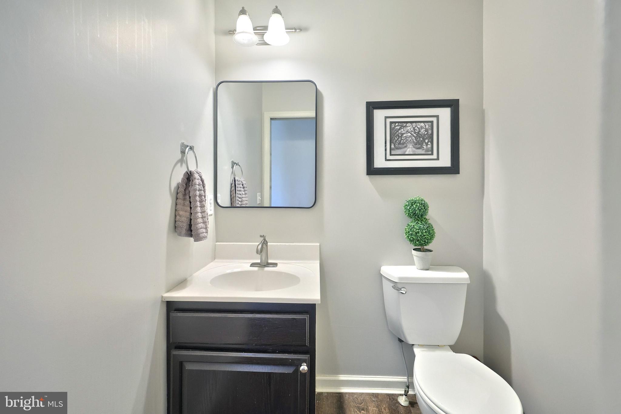 710 Apple Tree Lane Mount Wolf, PA 17347 - Photo 17 of 47 a bathroom with a toilet sink and mirror