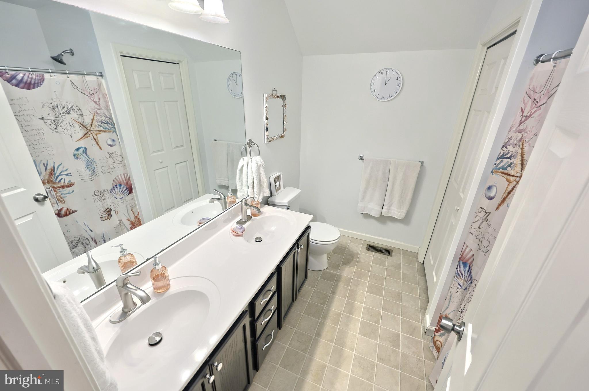 710 Apple Tree Lane Mount Wolf, PA 17347 - Photo 25 of 47 a spacious bathroom with a sink mirror and shower