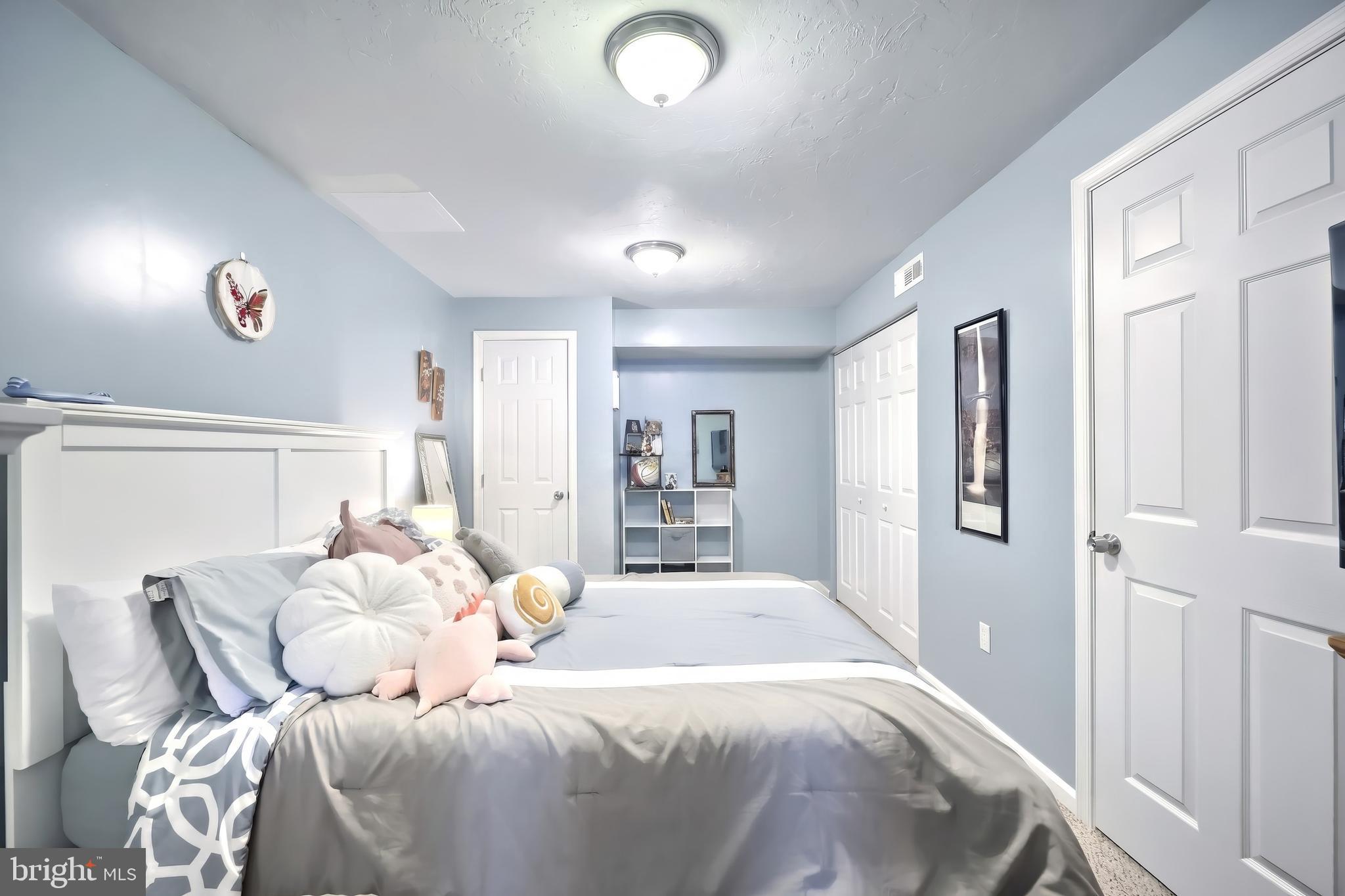 710 Apple Tree Lane Mount Wolf, PA 17347 - Photo 33 of 47 a bedroom with a large bed and a window