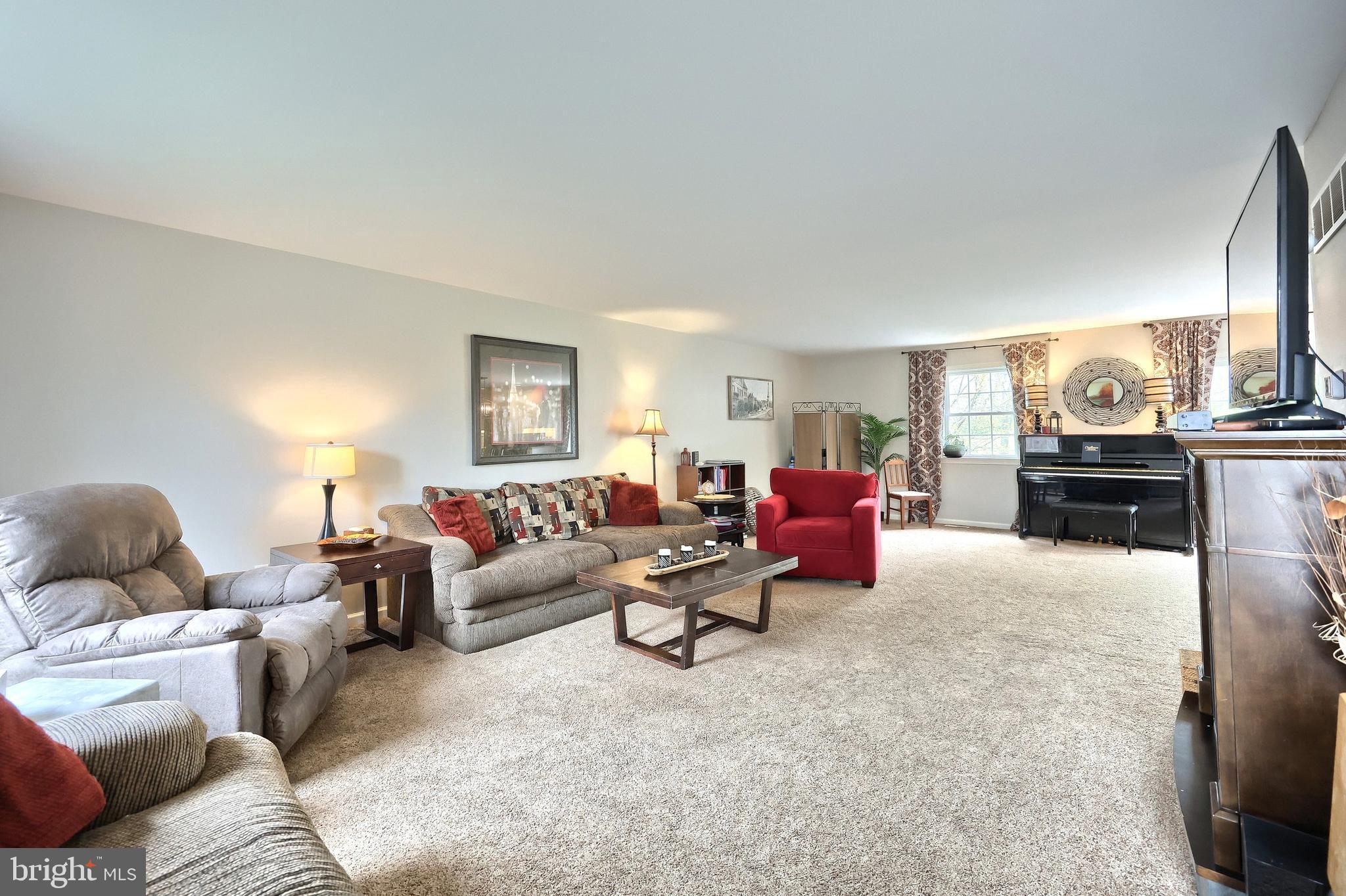 710 Apple Tree Lane Mount Wolf, PA 17347 - Photo 7 of 47 a living room with furniture and a fireplace