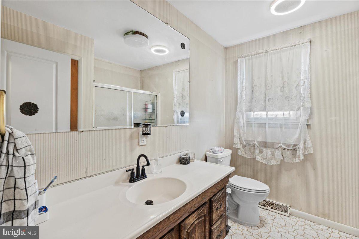 121 Catherine Avenue Buena, NJ 08310 - Photo 19 of 34 a bathroom with a sink toilet and shower