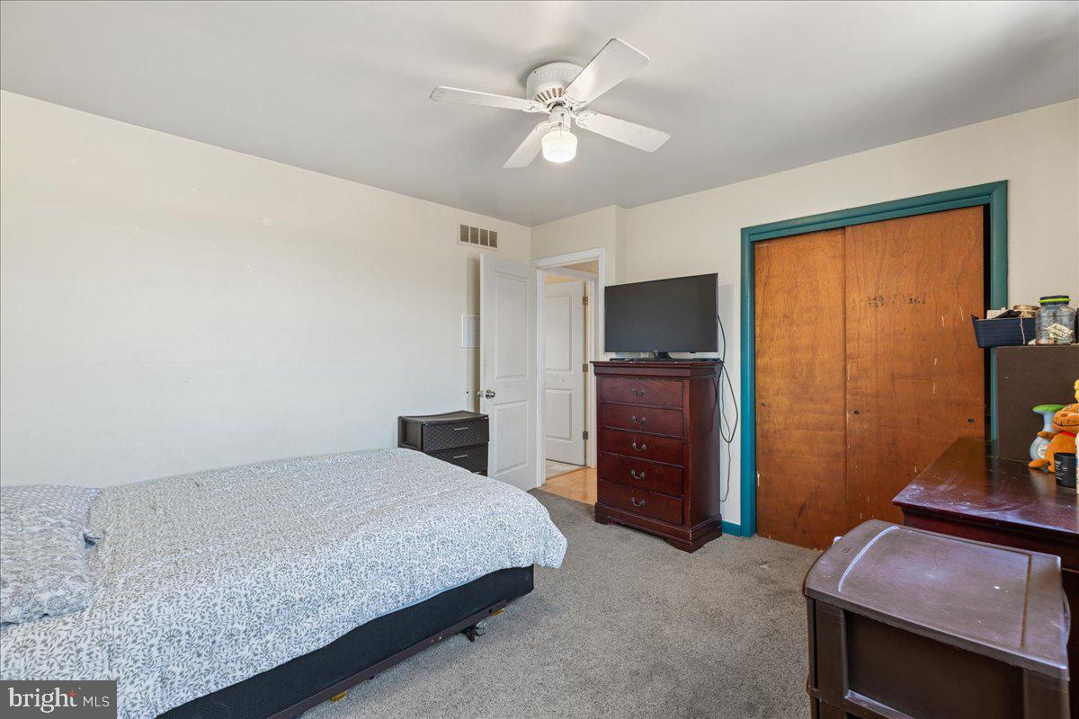 121 Catherine Avenue Buena, NJ 08310 - Photo 21 of 34 a bedroom with a bed and a flat screen tv