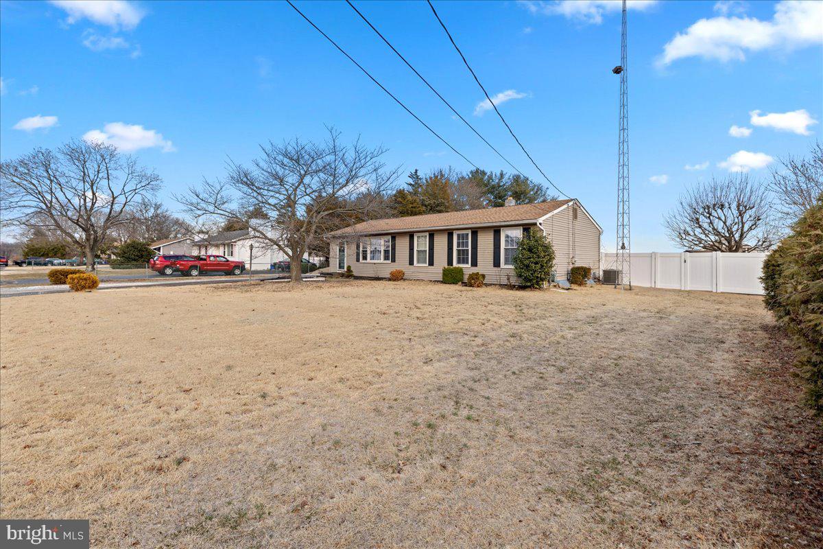 121 Catherine Avenue Buena, NJ 08310 - Photo 4 of 34 a view of street and trees in the background
