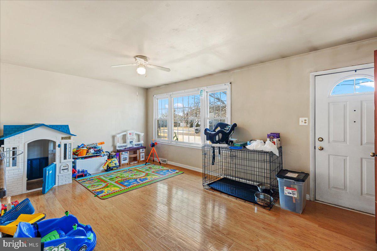 121 Catherine Avenue Buena, NJ 08310 - Photo 5 of 34 a living room with furniture and a wooden floor