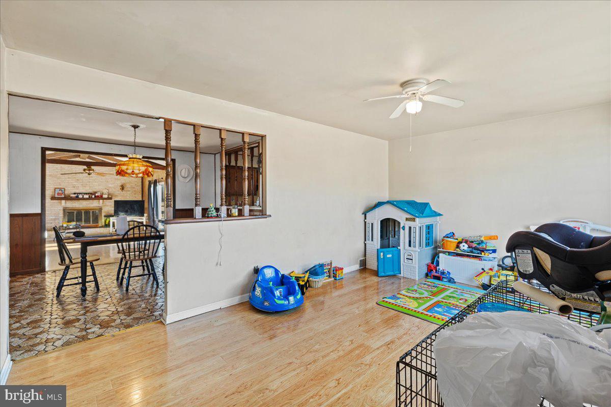 121 Catherine Avenue Buena, NJ 08310 - Photo 6 of 34 a view of a dining room with furniture a chandelier and wooden floor